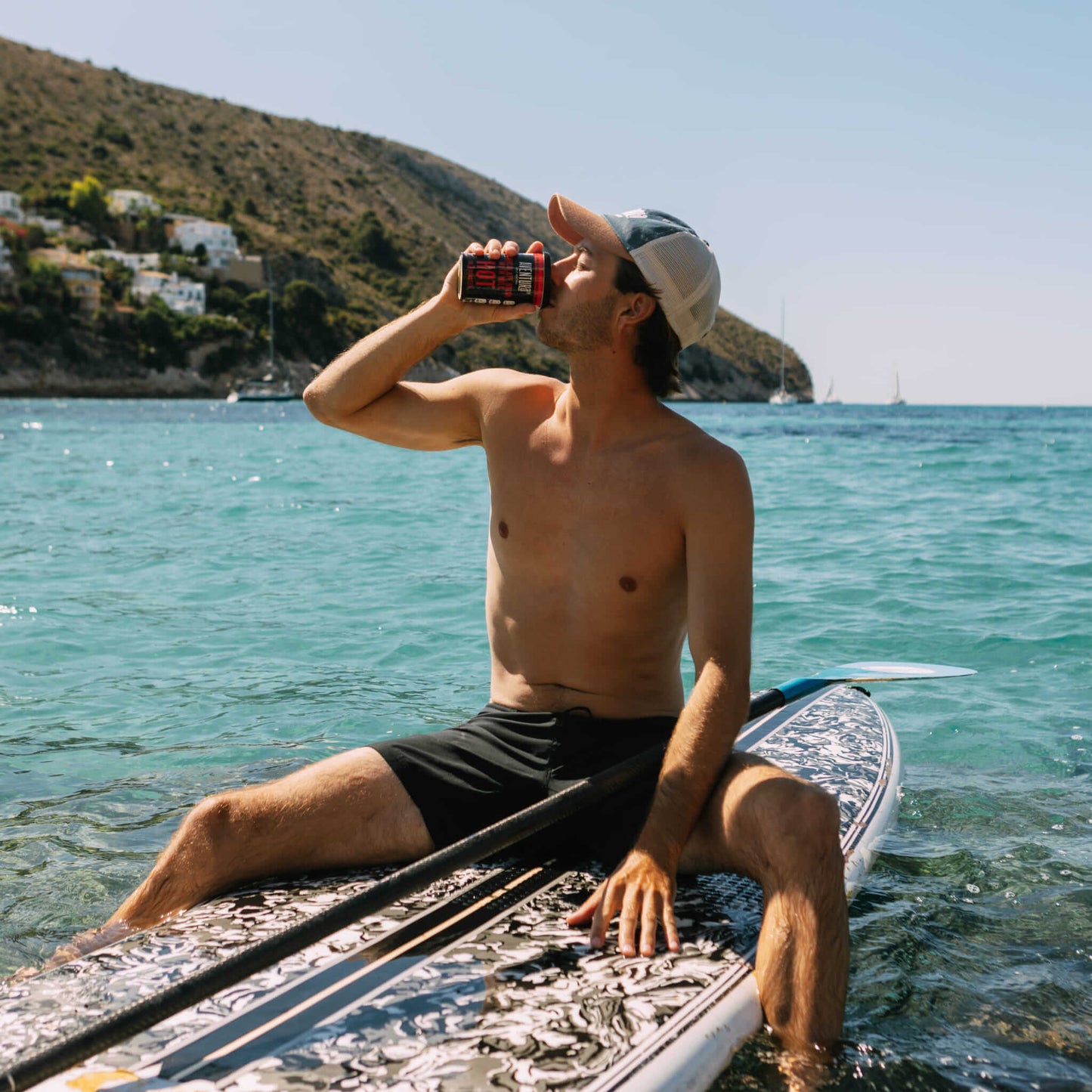 
                  
                    Aventura Self Heating Chocolate Drink Hot in 3 minutes being enjoyed by a person sitting on a paddle board in the sea
                  
                